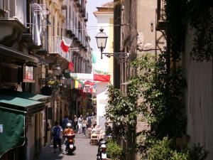 a group of people riding motorcycles down a street at Relais holiday in Sorrento