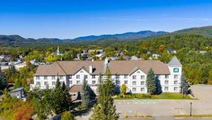 an aerial view of a hotel with mountains in the background at AX Hotel in Mont-Tremblant