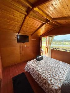 Ένα ή περισσότερα κρεβάτια σε δωμάτιο στο Cabaña Dulce Refugio +3 φωτογραφίες