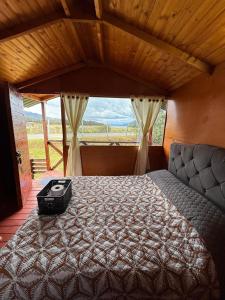 Ένα ή περισσότερα κρεβάτια σε δωμάτιο στο Cabaña Dulce Refugio