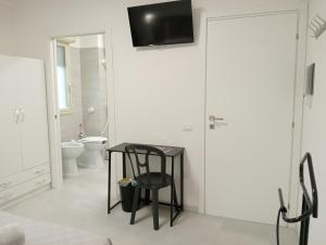a bathroom with a black table and a toilet at BnB Brotzu in Selargius +57 photos