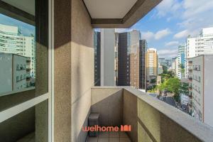 a balcony of a building with a view of a city at Flat na Bela Cintra duas quadras da Av Paulista in Sao Paulo