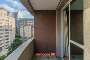 a balcony of a building with a view of the city at Flat na Bela Cintra duas quadras da Av Paulista in Sao Paulo