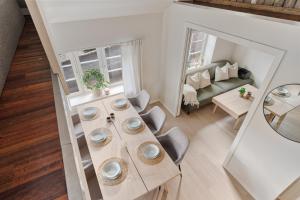 an overhead view of a living room with a table at Central loft apartment, with a view from the roof terrace in Tromsø