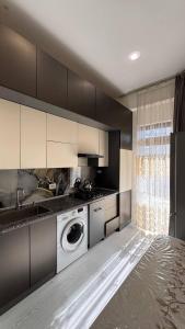 Kuchyň nebo kuchyňský kout v ubytování Boulevard Tashkent City