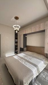 Postel nebo postele na pokoji v ubytování Boulevard Tashkent City