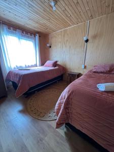 Una cama o camas en una habitación de "Cabaña A y M"