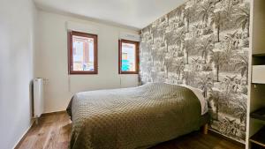 Ένα ή περισσότερα κρεβάτια σε δωμάτιο στο Le Terriers