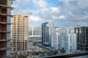 a view of a city with tall buildings at Luxury Apartment with Sea View & Free Parking in Tangier