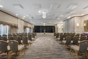 a conference room with chairs and a stage at Best Western Battlefield Inn in Manassas +23 photos