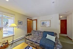 a living room with a couch and a table at The Lagoons 27 in Whistler