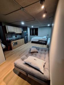 a living room with a couch in the middle of a room at Eureka Living in Bucaramanga +4 photos