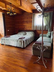 Ένα ή περισσότερα κρεβάτια σε δωμάτιο στο Уют