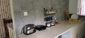 a kitchen counter top with a sink and a counter top at Casa de Andréa in Santo António