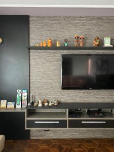 TV a/nebo společenská místnost v ubytování Pousada Lua Nova