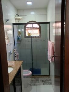a bathroom with a shower and a sink at House available for the Rock the Mountain event in Petrópolis +9 photos