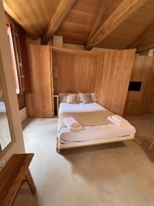 a bedroom with two beds in an attic at Ánimas, elegantes pisos en el centro histórico in Pontevedra