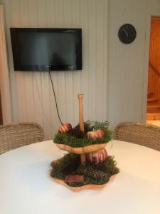 a table with a bowl of vegetables on top of it at Elanden rust in Edebäck