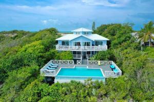 an aerial view of a house with a swimming pool at Neptune Villas in Five Cays Settlement