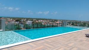 a swimming pool on the roof of a building at Ap Praia do Frances in Marechal Deodoro