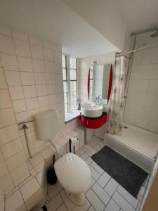 a bathroom with a toilet and a sink at 4 personen Monteur Ferien Wohnung in Merseburg