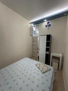 a small bedroom with a bed and a window at Paronyan 20 guest hause in Yerevan +7 photos