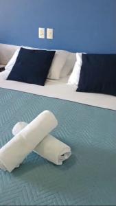Ένα ή περισσότερα κρεβάτια σε δωμάτιο στο Flat no Apart Hotel Marinas beira mar