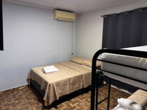 a small room with a bed with a towel on it at 3bed Apartments Center in David