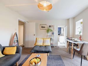 a living room with a couch and a table at 1 Bed in Aberaeron 49261 in Aberaeron