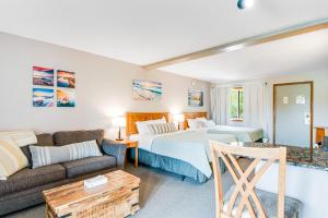 a hotel room with two beds and a couch at Chula Vista Resort Villa # 7111 in Wisconsin Dells