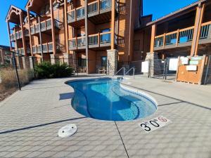 a swimming pool in front of a building at Chula Vista Resort Villa # 7111 in Wisconsin Dells