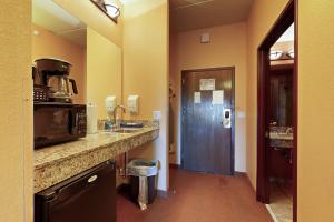 a kitchen with a counter and a sink and a door at Chula Vista Resort Condo # 2520 in Wisconsin Dells +17 photos