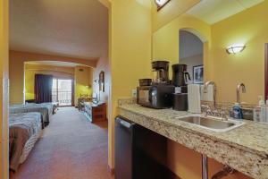 a hotel room with a sink and a bed at Chula Vista Resort Condo # 2520 in Wisconsin Dells