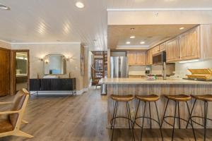 a kitchen with a counter and some bar stools at Tamarron Lodge #752 in Rockwood