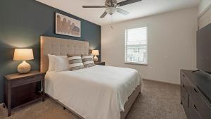 a bedroom with a bed and a ceiling fan at Landing at Cove at Pine Ridge - 1 Bedroom in Lyman in Lyman +59 photos