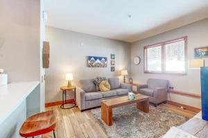 a living room with a couch and a table at Los Pinos #D10 in Breckenridge
