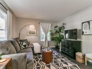 a living room with a couch and a tv at 1402 Crescent in Ames