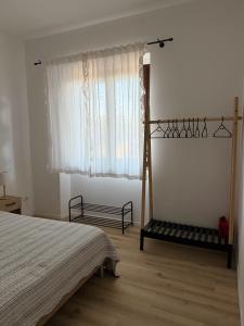 a bedroom with a bed and a window at Ca' dei lecci in Tuoro sul Trasimeno