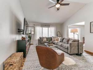 a living room with a couch and a chair at 4901 Waller in Ames +39 photos