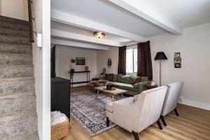 a living room with a couch and a table at Modern 3BR Getaway-Stylish Ames in Ames