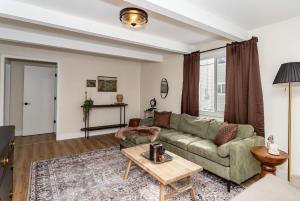 a living room with a couch and a table at Modern 3BR Getaway-Stylish Ames in Ames
