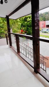 an open balcony with a view of a street at Chalé em Ilhabela 02 in Ilhabela