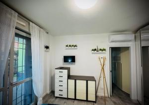 a room with a desk and a window at Maison Du Pic - Rho Fiera in Pero