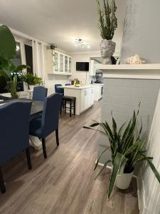 a kitchen and living room with a table and chairs at Classic Colonial House facing Niagara Falls in Niagara Falls +15 photos