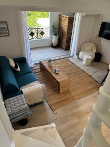 a living room with a couch and a coffee table at Mare Gaillard in Mare Gaillard