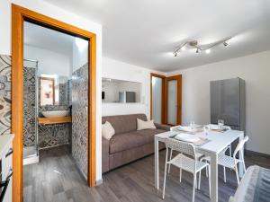 a living room with a white table and a couch at Le due Sicilie -Ragusa Guest House in Ragusa +18 photos