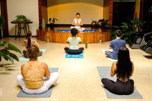 a group of people sitting in a yoga class at Casa Coyota Hotel in Monteverde Costa Rica
