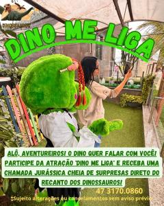 a flyer with a woman standing next to a stuffed animal at Hotel Recanto dos Dinossauros in Penha