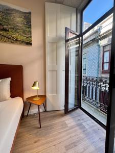 Giường trong phòng chung tại Douro Views by MyMoradia