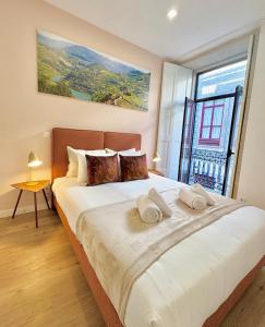 Giường trong phòng chung tại Douro Views by MyMoradia